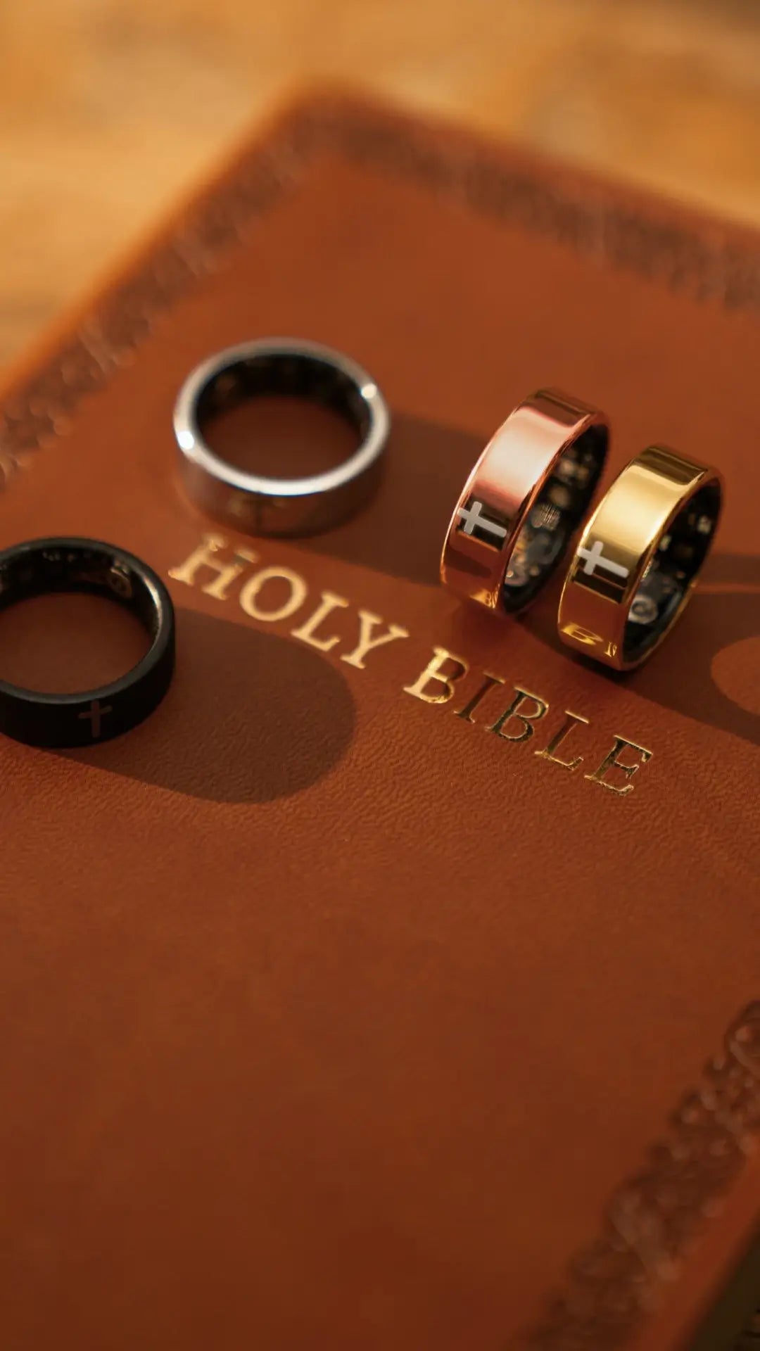 Elah Ring color options resting on a Bible