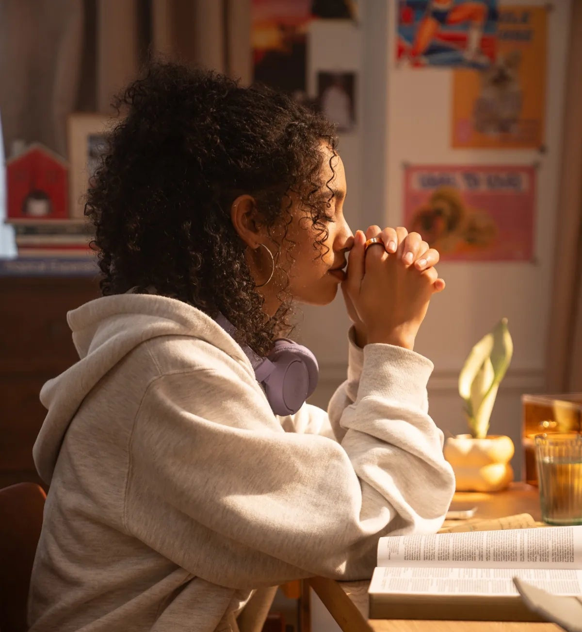 A quiet moment of reflection at a desk with an open book